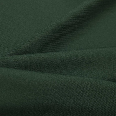 Ткань костюмная 21010 2076, 225 гр/м2, шир.150см, цвет т.зеленый - купить в Калуге. Цена 390.73 руб.